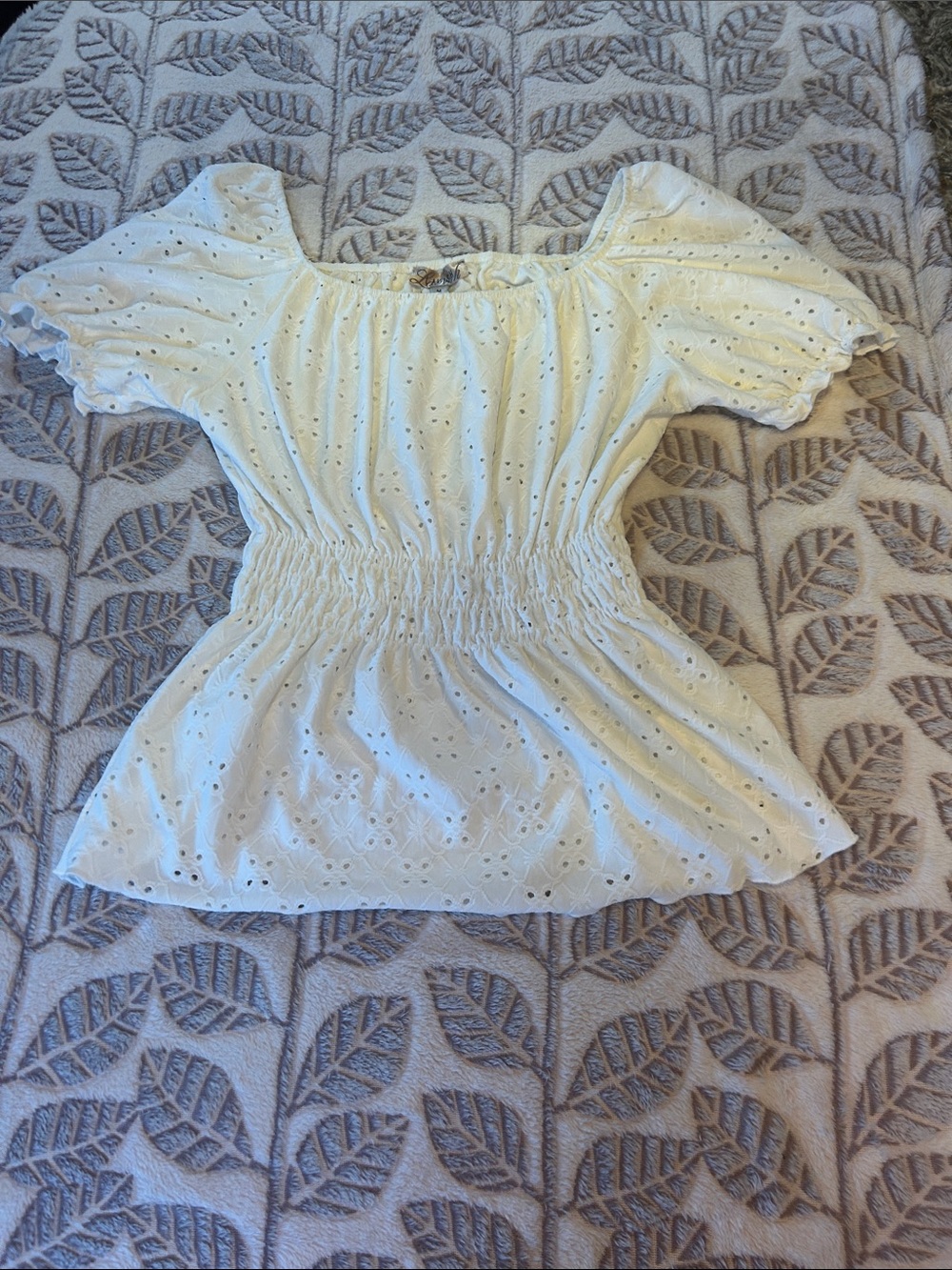 Women's white size small Eyelet Smocked Peplum Top. Romantic & Flirty